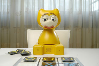 Figure 1: iCat, here as a game buddy for children.