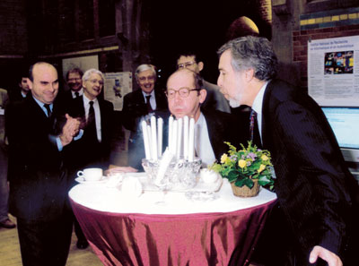ERCIM celebrated its 10th anniversary in Amsterdam in November 1999. ERCIM president Gerard van Oortmerssen (center) and Stelios Orphanoudakis who succeeded him as president in 2004, are blowing the candles. Sadly, due to illness, Stelios presidency was all too short. 