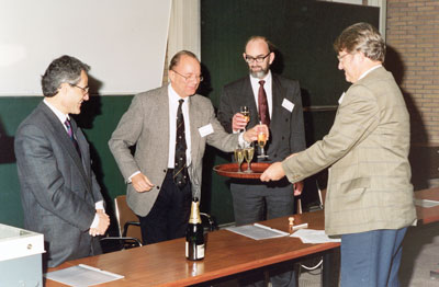 ERCIM Directors give a toast on Rutherford Appleton Laboratory (RAL) joining ERCIM as fourth ERCIM member in November 1990. From left: Alain Bensoussan (INRIA), Gerhard Seegmuller (GMD), Paul Williams (RAL), Cor Baayen (CWI).